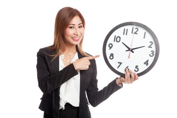 Young Asian business woman point to a clock - Zdjęcie, obraz