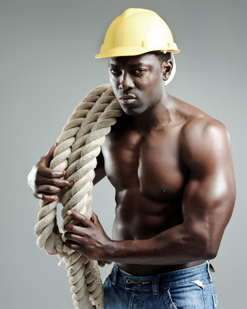 Hardworking muscular man - 写真・画像