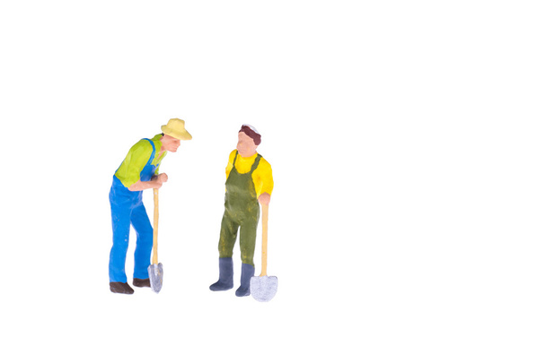 Close up of Miniature gardener people isolate on white background. - Foto, immagini