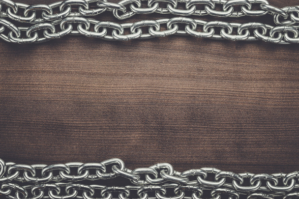 big chains on the wooden background - Photo, image