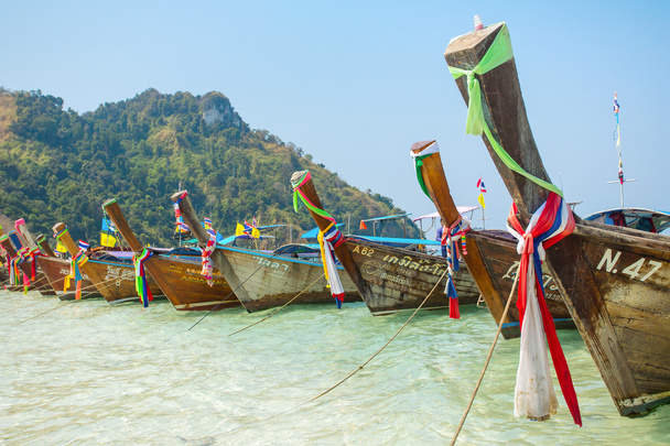 Longtail boats at tropical beach - 写真・画像