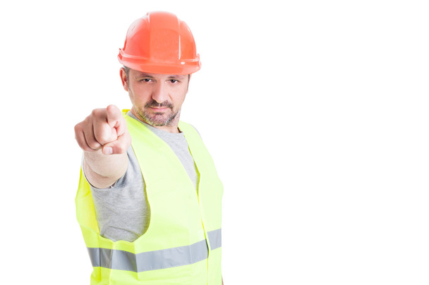 Young builder working and pointing finger at you  - Photo, Image