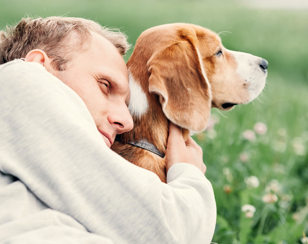 Man hugs his  dog - Фото, изображение