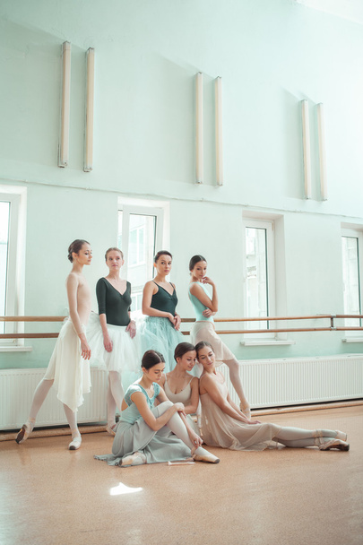 The seven ballerinas at ballet bar - Photo, Image