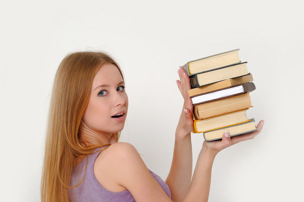 Young woman with books - Fotoğraf, Görsel