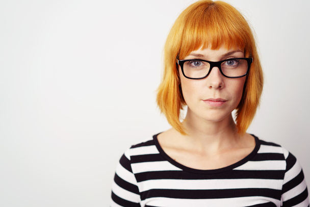 Earnest young redhead woman wearing glasses - Fotografie, Obrázek