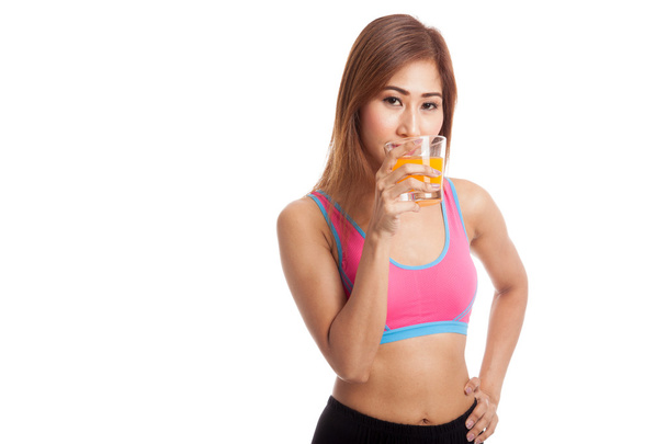 Beautiful Asian healthy girl drinking  orange juice - Фото, зображення