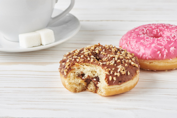 Donuts and cup of coffee - Фото, зображення