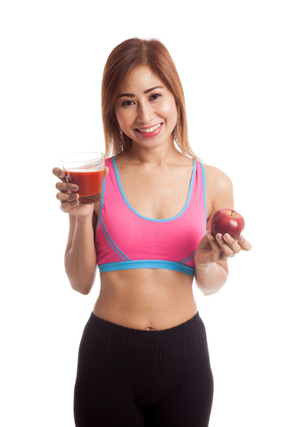 Beautiful healthy Asian girl with tomato juice and apple - Foto, Imagen