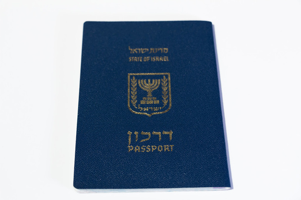 Паспорт гражданина Израиля на белом фоне - вид сверху
 - Фото, изображение
