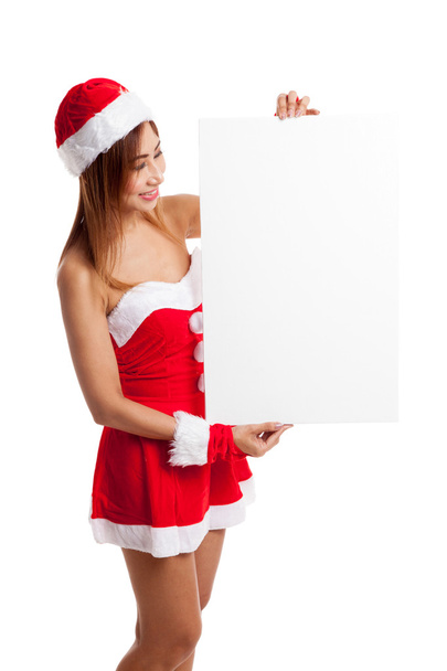 Asian Christmas girl with Santa Claus clothes with blank sign - Foto, Imagen