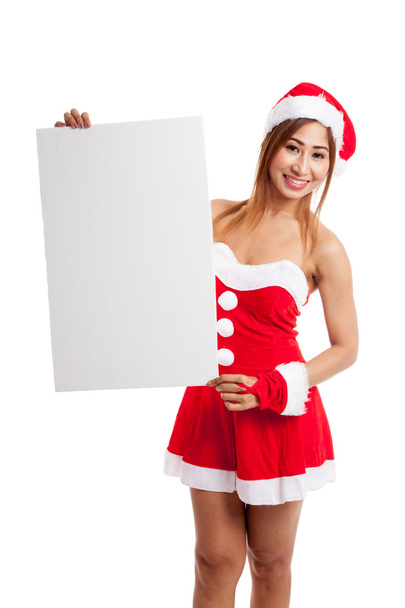 Asian Christmas girl with Santa Claus clothes with blank sign - Fotó, kép
