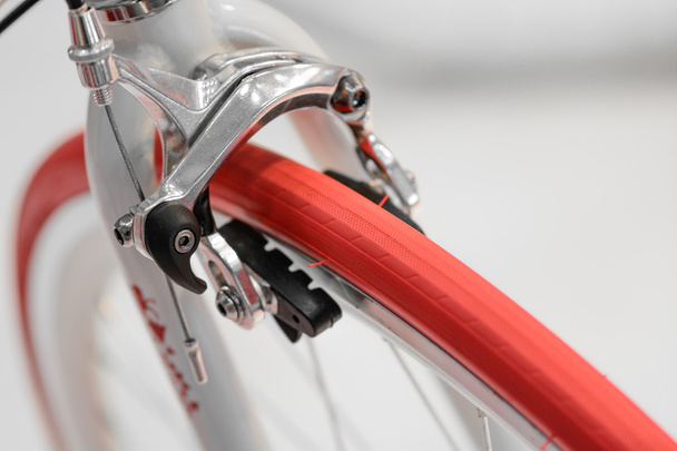 Closeup view of bike red wheel. Detail with red bike wheel isola - Zdjęcie, obraz