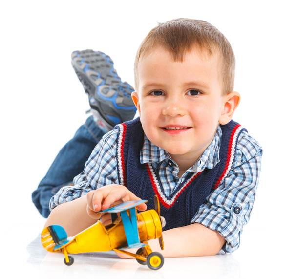 Cute little boy playing with a toy airplane - Foto, Imagen