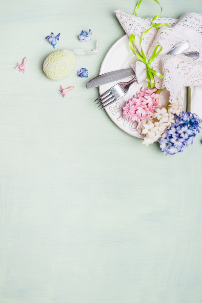 Festive tableware and flowers - Фото, изображение