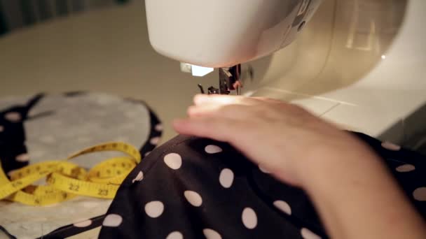 Close up shot of a tailor behind a sewing machine - Footage, Video