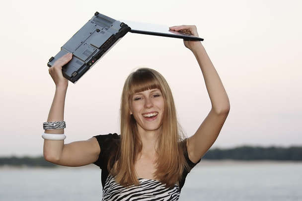 Young woman with her laptop - Zdjęcie, obraz