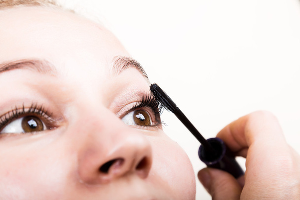 Beautiful young woman eyelash extension. Woman eye with long eyelashes. Beauty salon concept - Foto, Imagen
