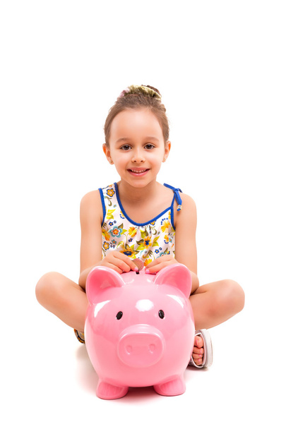 Girl with a new piggybank  - Foto, imagen