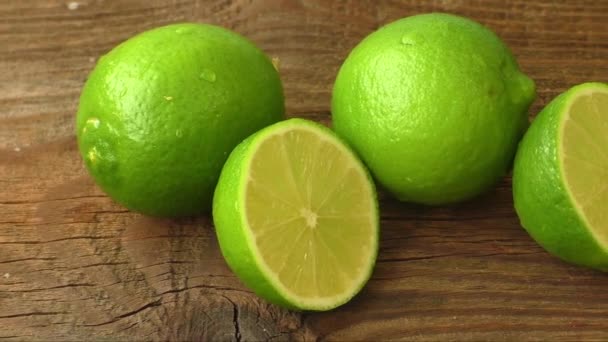 Fresh limes on wooden background  - Footage, Video