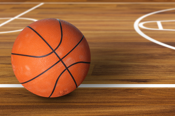 Basketball ball over hardwood basketball court - Photo, Image