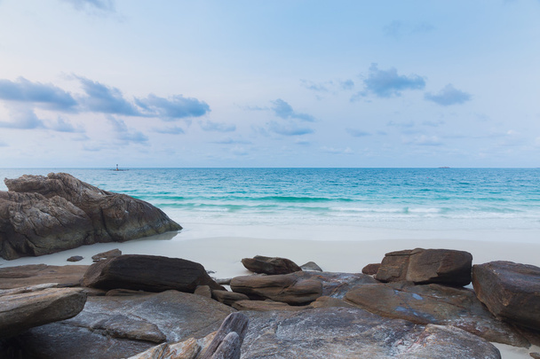 Rock on the beach with clear blue sky, natural landscape background - Fotografie, Obrázek