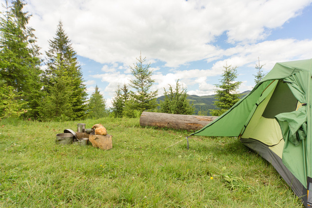 Camping in a mountainous area with cooking equipment. - Photo, image