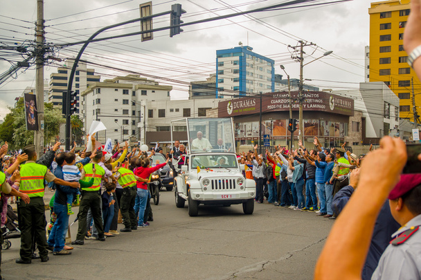 QUITO, ECUADOR - JULY 7, 2015: Pope Francisco arriving to Ecuador, people on the streets saying welcome, police on the sides - Фото, зображення
