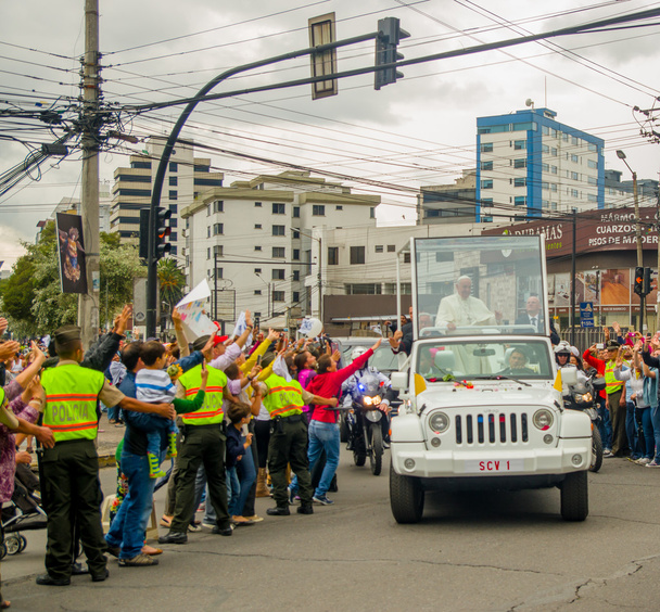 QUITO, ECUADOR - JULY 7, 2015: Very emocional and nice moment of pope Ecuador arriving to Ecuador, popemobile in white color - 写真・画像