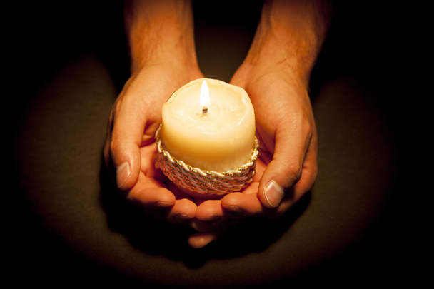 Hands with candle - Photo, Image