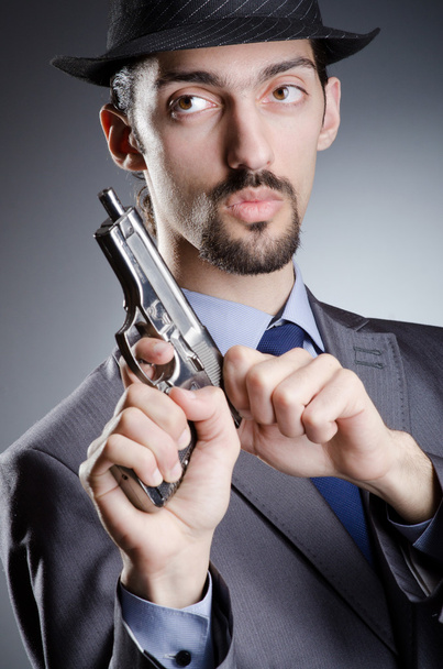 Businessman man with hand gun - Foto, imagen