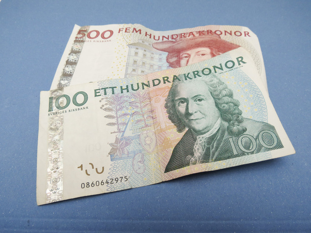 Шведська валюти Sek зі Швеції на синьому фоні - Фото, зображення