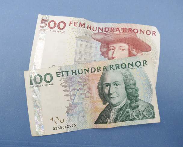 Ruotsin valuutta SEK alkaen Sweden over blue background
 - Valokuva, kuva