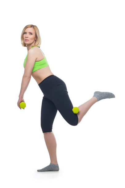 Beautiful woman doing sport exercise with dumbbells - Valokuva, kuva