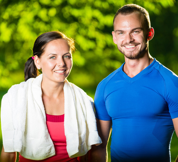 Athletic man and woman after fitness exercise - Photo, Image