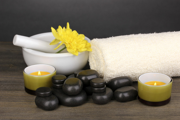 Spa setting on wooden table on grey background - Foto, imagen