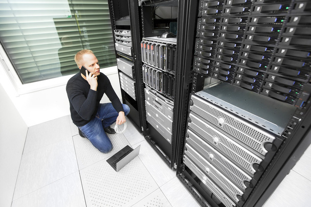 IT consultant solving problem with support in datacenter - Photo, Image