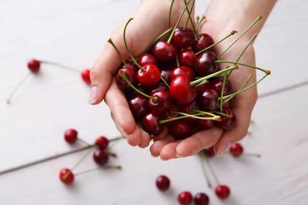 Sweet fresh cherries on white wood background - Photo, Image