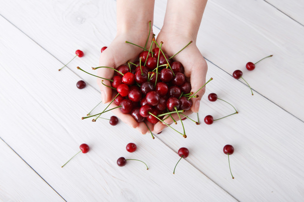 Sweet fresh cherries on white wood background - Photo, Image