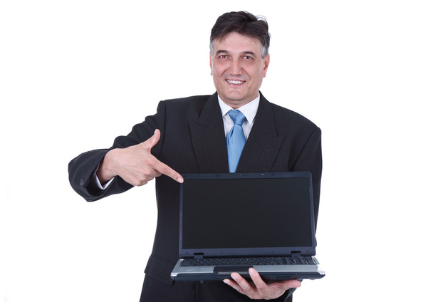 Senior businessman pointing at laptop - Fotó, kép