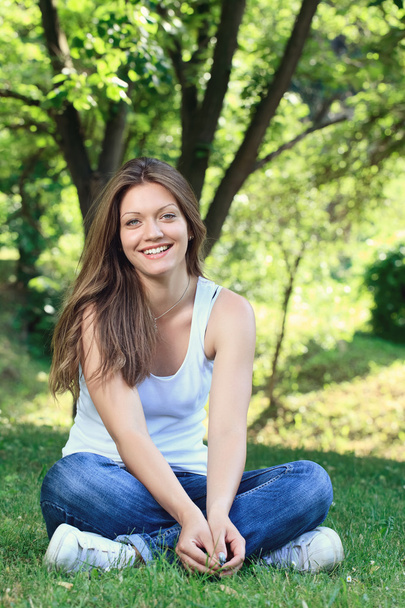 Smiling girl in park - Photo, image