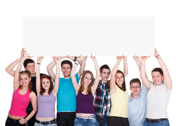 Group of nine young smiling holding blank banner - Fotó, kép
