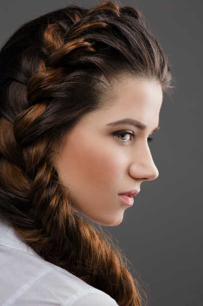 Woman with modern hairstyle in studio - Foto, Imagen