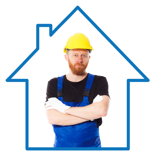 Homem construtor no uniforme azul
 - Foto, Imagem
