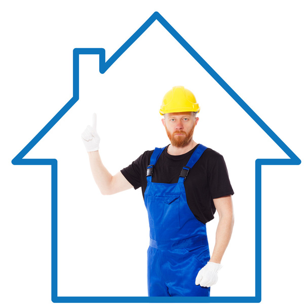 Homem construtor no uniforme azul
 - Foto, Imagem