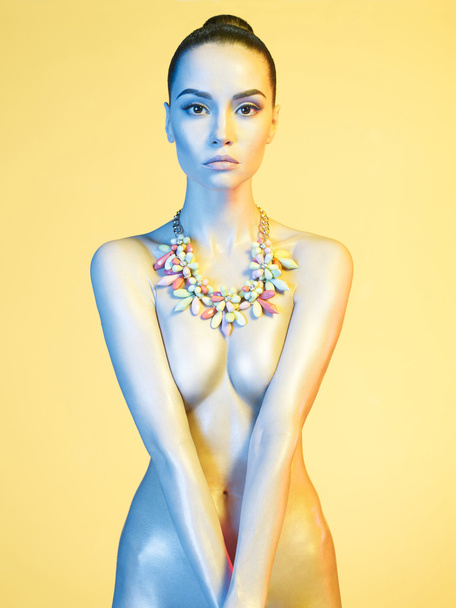 nude sexy model in the light colored spotlights - Foto, immagini