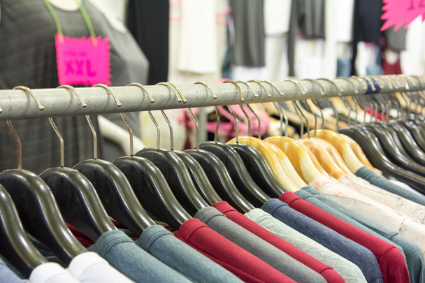 The fashion clothing on hangers. - Photo, Image