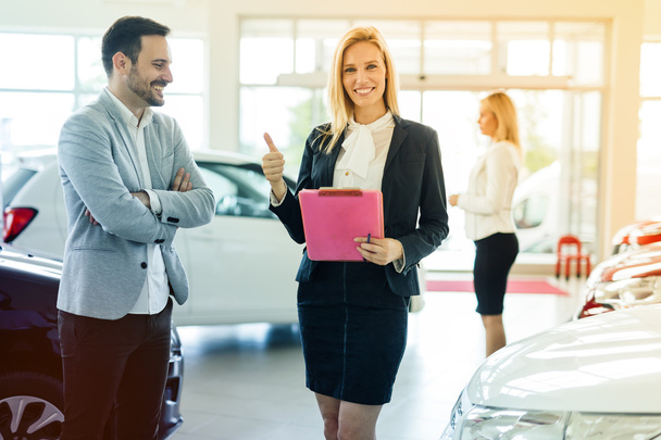 Customer looking for a car at dealership - Photo, Image