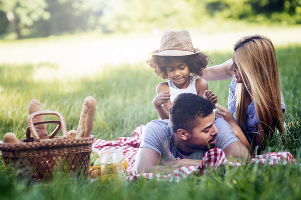 Family picnicking outdoors - Φωτογραφία, εικόνα