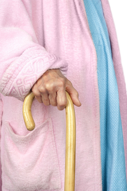 Elderly woman walking with cane - Фото, зображення